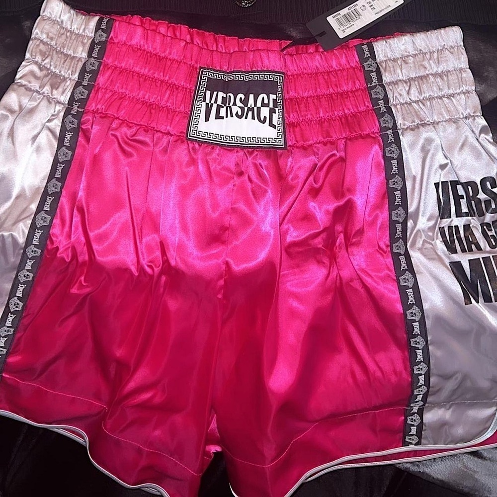 Versace UFC boxing shorts. Shiny metallic pink with black and white Medusa head